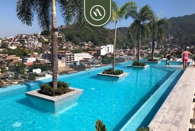 1BR Condo with Rooftop Pool - Romantic Zone
